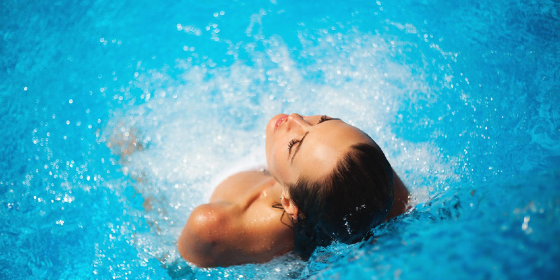 Beautiful woman in a swimming pool